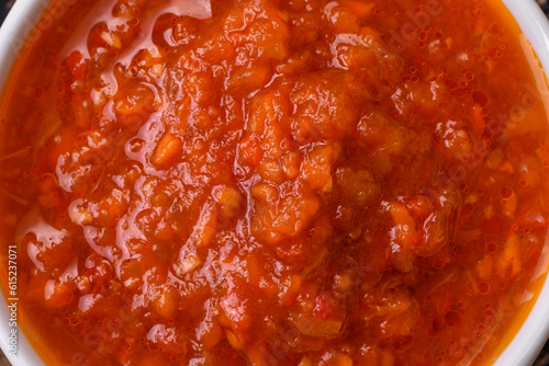 Delicious spicy tomato sauce with pepper, garlic, salt, spices and herbs