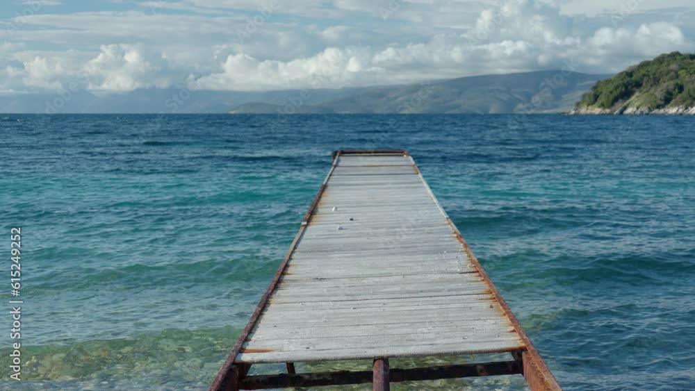 wooden pier on beach in corfu greece wooden pier on beach in corfu greece