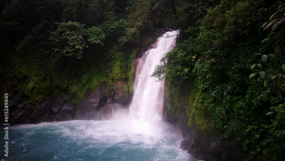 Fototapeta premium Peaceful Waterfall in the middle of the rain forest in central america