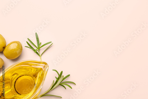 Gravy boat with fresh olive oil on pink background
