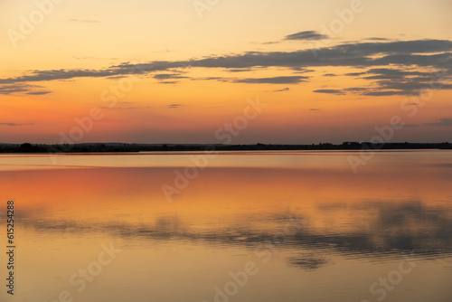 Fototapeta Naklejka Na Ścianę i Meble -  multicolored sky during sunset on the lake