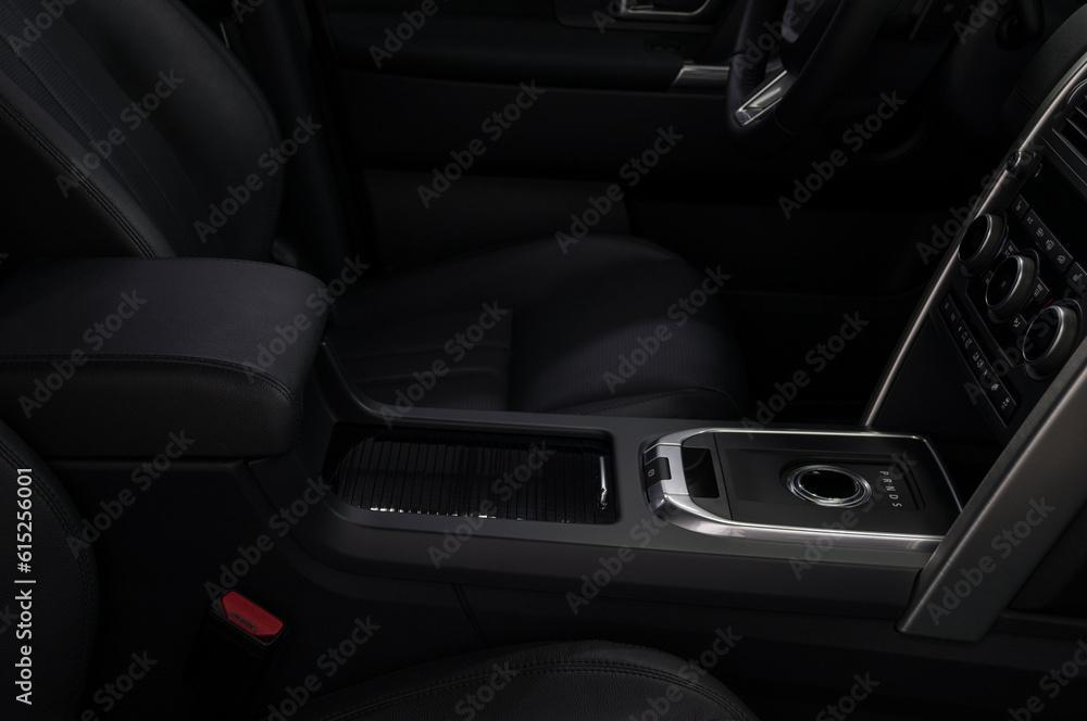 Modern car interior with automatic transmission shift lever.