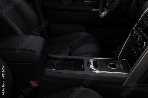 Modern car interior with automatic transmission shift lever. © alexdemeshko