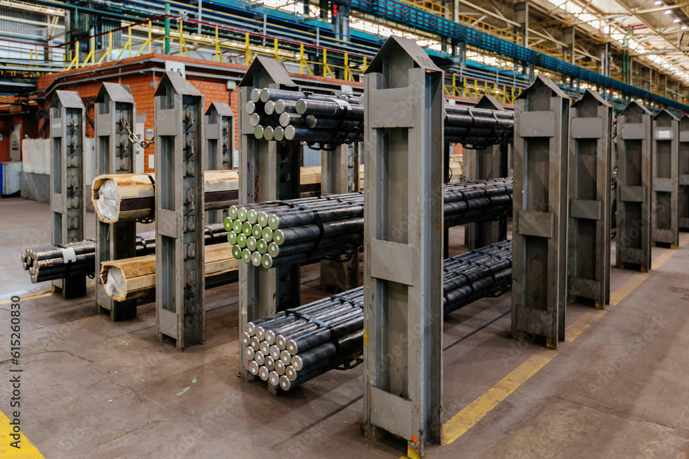 Packs of rolled metal bars on the shelves Packs of rolled metal bars on the shelves