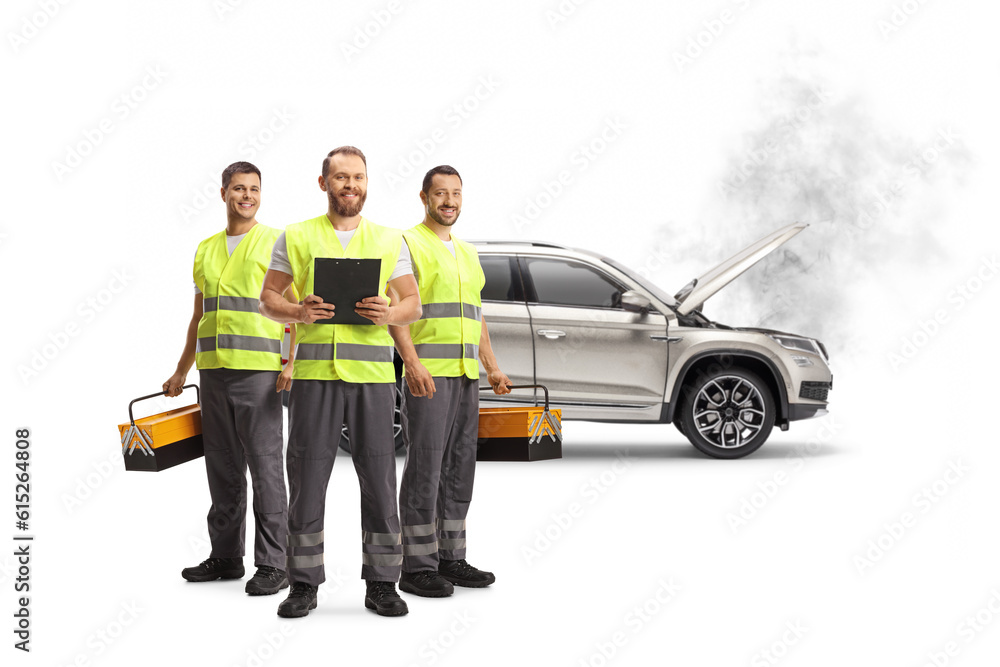 Team of road assistance workers with reflective vests standing in front of a SUV Team of road assistance workers with reflective vests standing in front of a SUV
