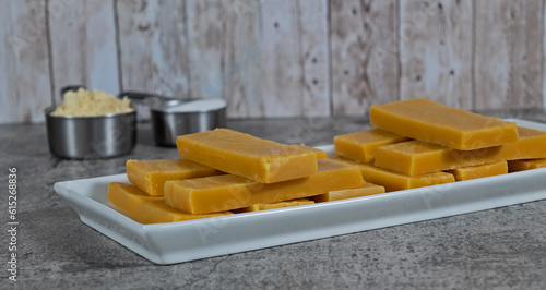 Besan barfi closeup a famous Diwali time Indian sweet made with Chickpea flour , sugar and Ghee.