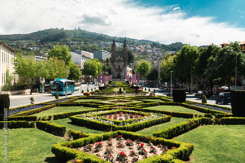 Guimaraes, Portugal. April 14, 2022: Largo da Oliveira with blue sky and garden.