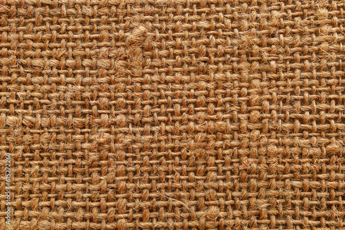 Rough textured surface of burlap or canvas close-up. Background or backdrop. Design blank