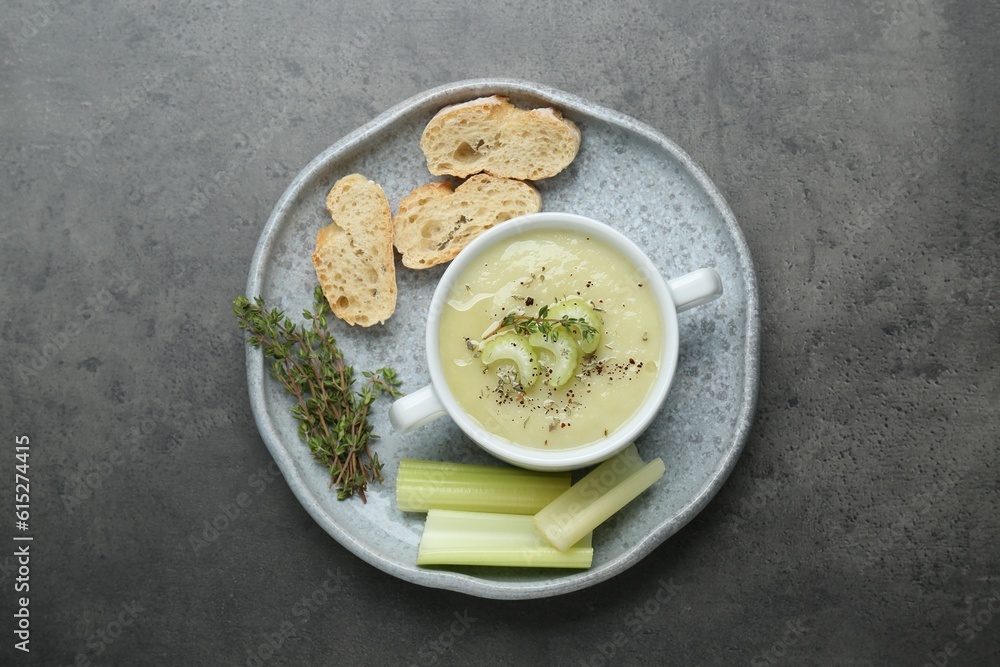 Delicious celery soup on gray table, top view Delicious celery soup on gray table, top view