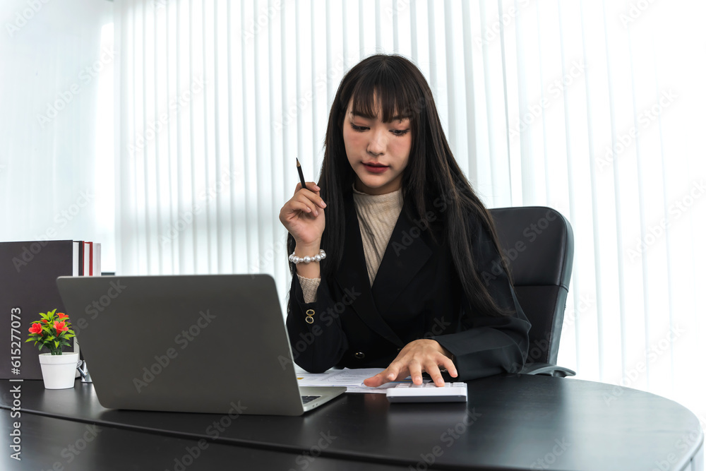 Young smiling start up businesswoman working in office Young smiling start up businesswoman working in office