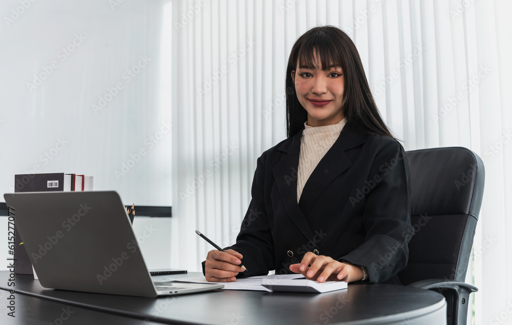 Young smiling start up businesswoman working in office Young smiling start up businesswoman working in office