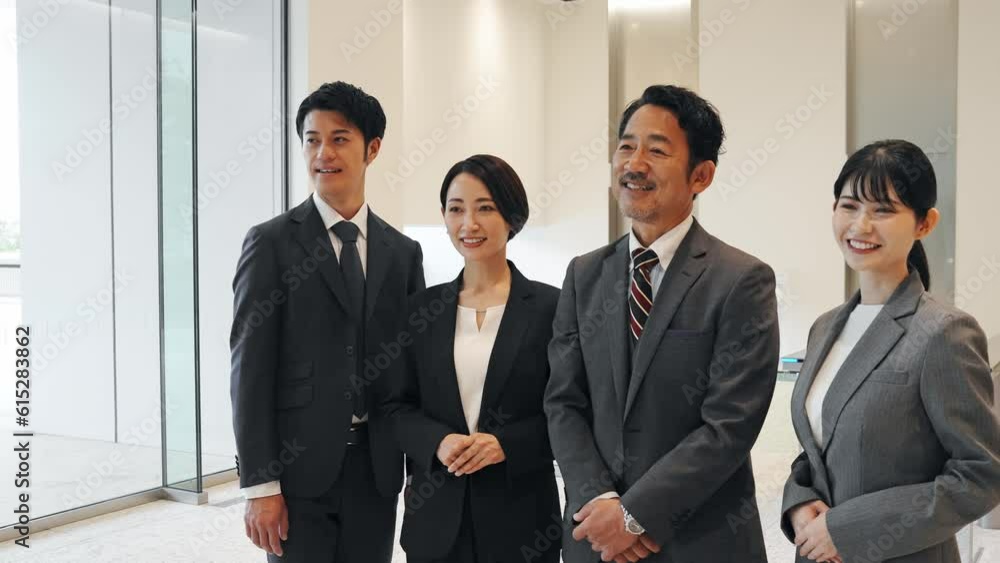 Group of various generation Asian businesspeople lining in lobby. Company employees who challenge for success. Group of various generation Asian businesspeople lining in lobby. Company employees who challenge for success.