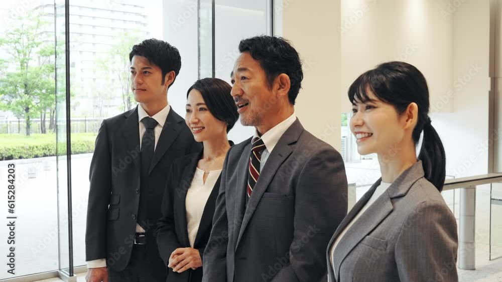 Group of various generation Asian businesspeople lining in lobby. Company employees who challenge for success. Group of various generation Asian businesspeople lining in lobby. Company employees who challenge for success.