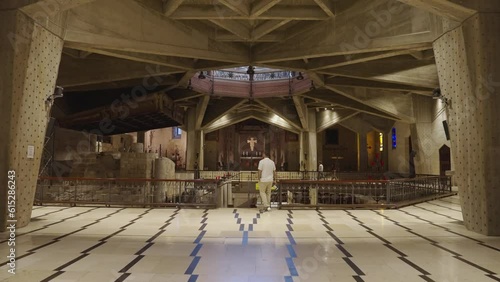 Photographer overlooks grotto inside Annunciation Basilica in Nazareth photo