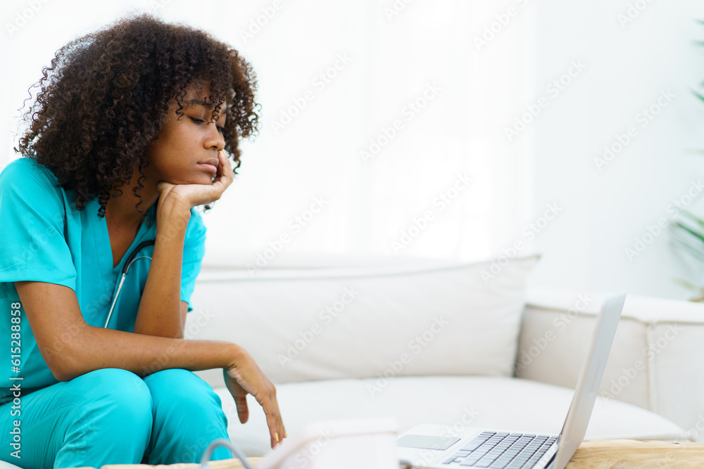 Hard working of American African black ethnicity young female doctor in hospital, stressful - workaholic health care worker in hospital. Medication working tired from hard working. Hard working of American African black ethnicity young female doctor in hospital, stressful - workaholic health care worker in hospital. Medication working tired from hard working.