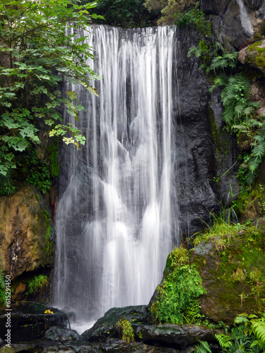 Slow motion natural cascade waterfall  tropical rainforest waterscape  long exposure shot  slope of rocks  beautiful nature for background wallpaper