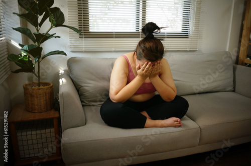 Fat diet and scale feet standing on electronic scales for weight control. photo