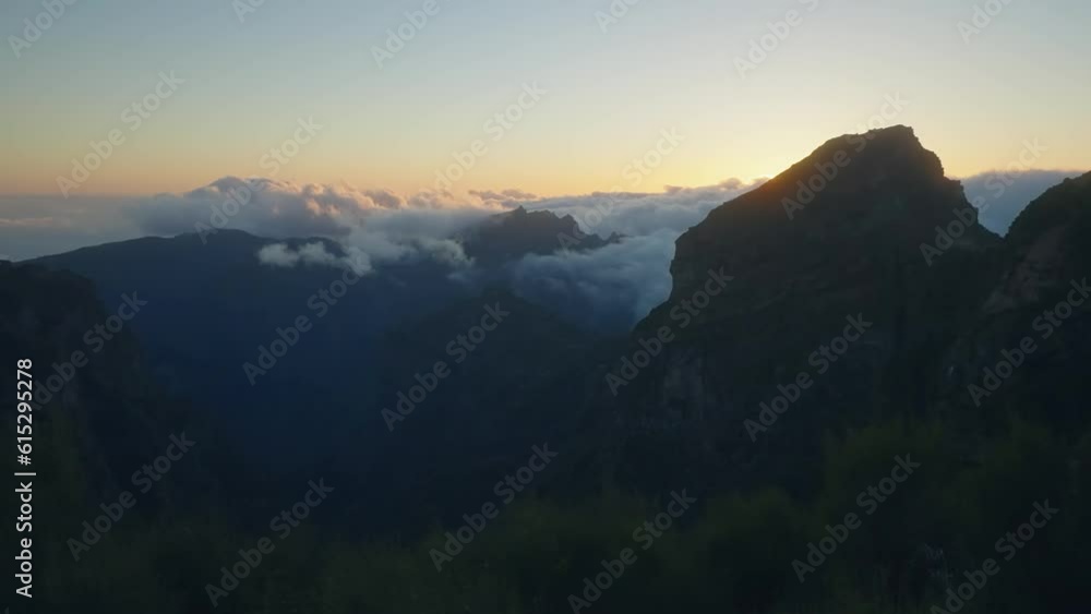 Peaceful sunset on mountains, fog in distance Peaceful sunset on mountains, fog in distance