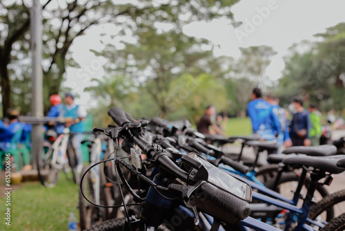 A number of bicycles are parked neatly at the Sentul roundabout during a leisurely cycling event on a sunny morning	
 photo
