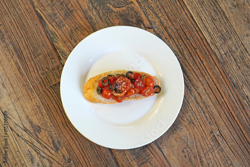 Wallpaper Mural Bruschetta. Cherry tomatoes and olives Bruschetta, vegetarian food. Selective focus Torontodigital.ca