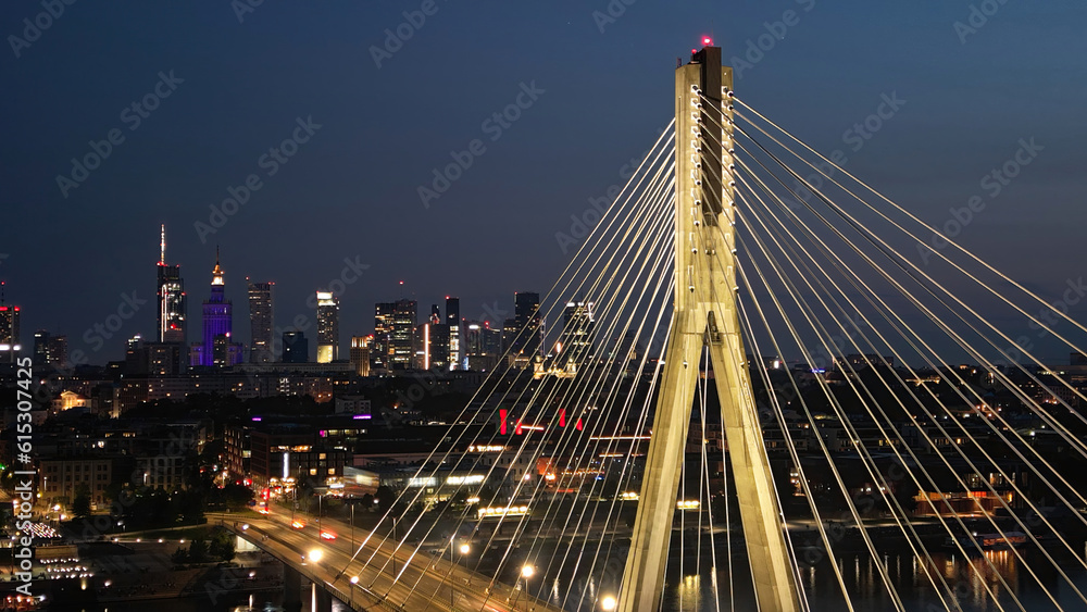 Obraz premium Swietokrzyski bridge on Vistula river in Warsaw at night.
