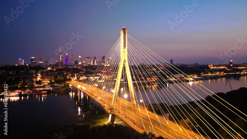 Swietokrzyski bridge on Vistula river in Warsaw at night.