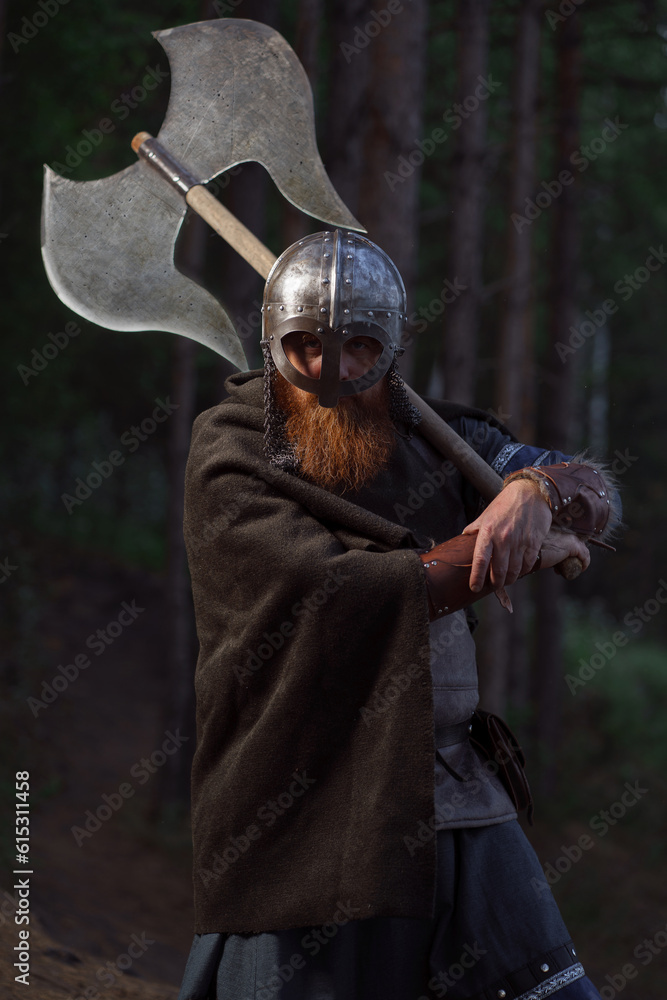 Fototapeta premium Fantasy medieval red-haired gnome warrior with beard with huge ax halberd in forest