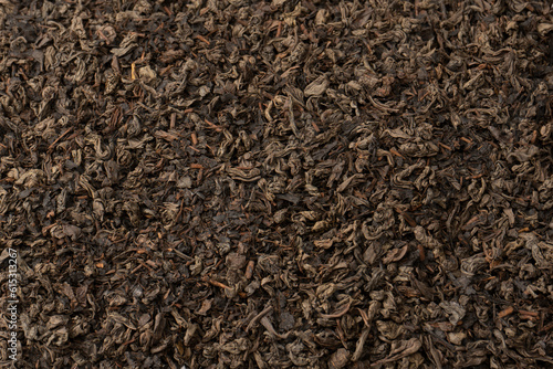 Dried tea leaves as a background.