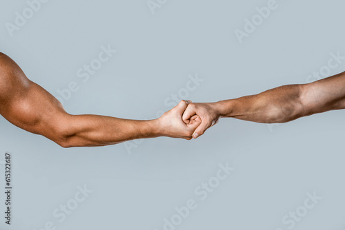 Strong hold. Two hands, helping hand of a friend. Handshake, arms friendship. Friendly handshake, friends greeting, teamwork, friendship. Close-up. Rescue, helping gesture or hands