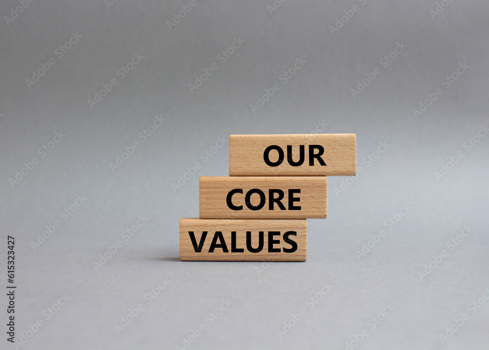 Our core values symbol. Concept words Our core values on wooden blocks. Beautiful grey background. Business and Our core values concept. Copy space.