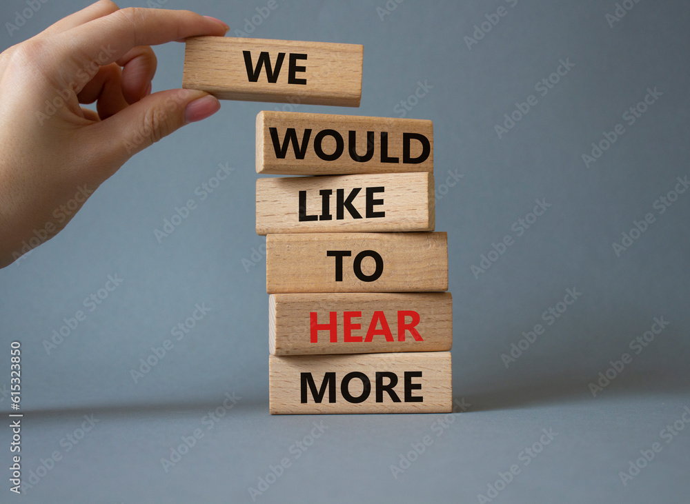 We would like to hear more symbol. Wooden blocks with words We would like to hear more. Beautiful grey background. Businessman hand. Business and We would like to hear more. Copy space. We would like to hear more symbol. Wooden blocks with words We would like to hear more. Beautiful grey background. Businessman hand. Business and We would like to hear more. Copy space.