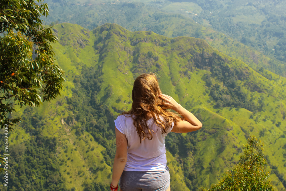Female Tourist at Ella Peak Mountain in Sri Lanka