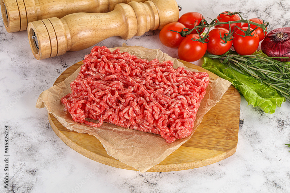 Raw minced beef meat on cutting board Raw minced beef meat on cutting board