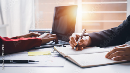 Businesswoman working in office, report papers , financial chart analysis company financial budget report with calculator and accounting financial statement planning.