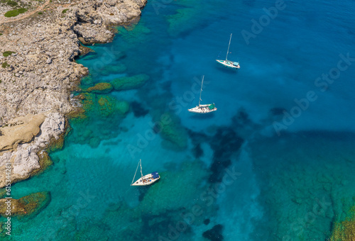 Aerial view of boats in the turquoise sea in Kalithea Rhodes Greece