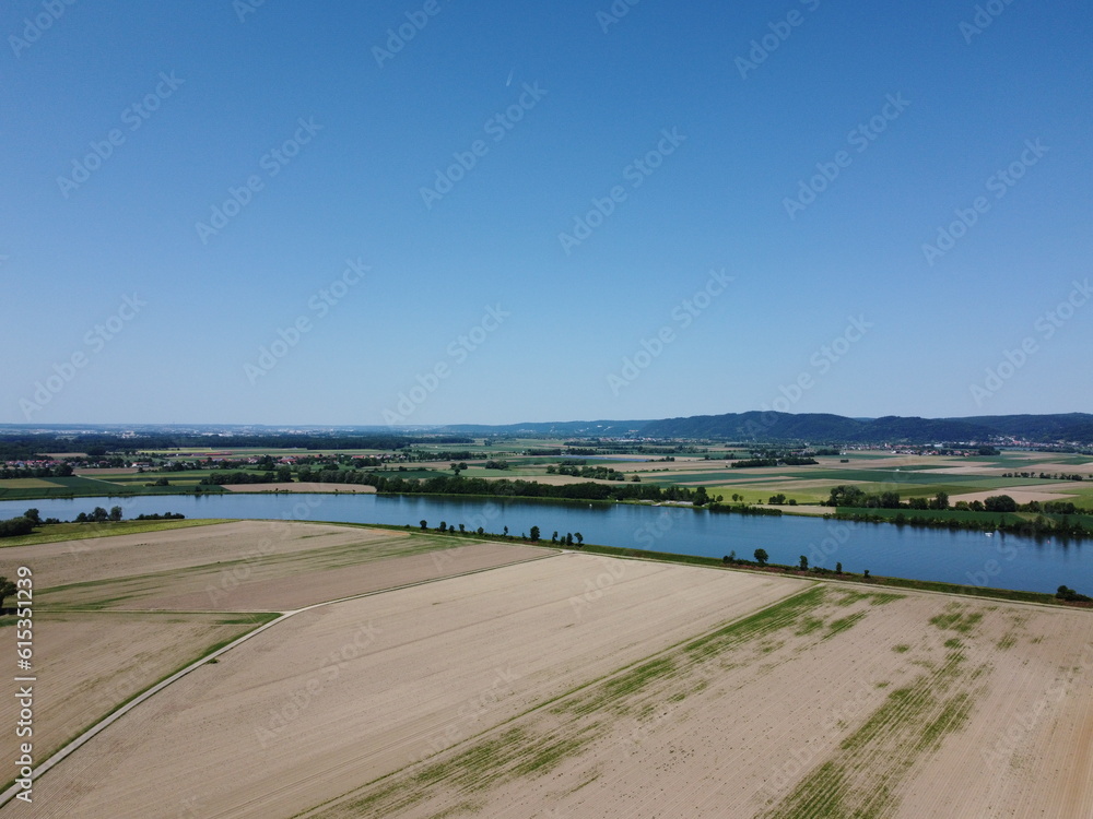 Fototapeta premium Danube river with dried up fields near Donau and the lock in Geisling,