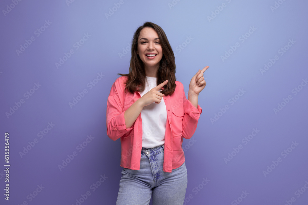 nice looking european brunette 30s woman in pink shirt with inspiration on studio background with copy space nice looking european brunette 30s woman in pink shirt with inspiration on studio background with copy space