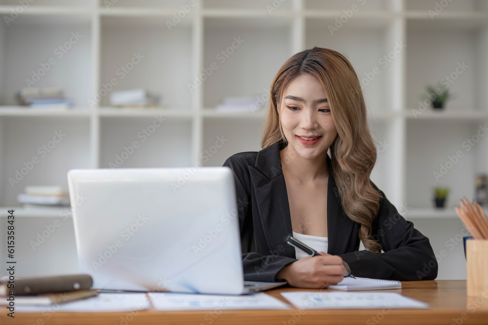 young asian woman sitting and taking note at house. Happy smiling working online, Freelance work at home young asian woman sitting and taking note at house. Happy smiling working online, Freelance work at home