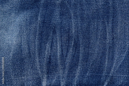 Blue jeans fabric background texture. Background denim texture. Denim jean cloth in blue color. Close up view. Flat lay background.