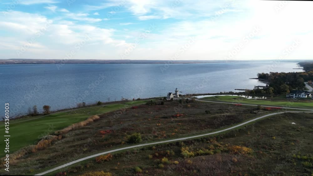 Aerial shot of a golf course running along the lakeshore of a large lake. Aerial shot of a golf course running along the lakeshore of a large lake.