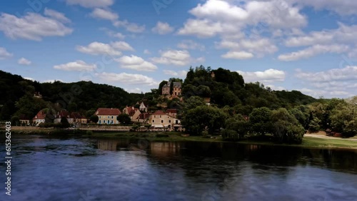 Timelapse of the beautiful village of Limeuil above the Dordogne river. With beautiful clouds on one that announce a storm, Dordogne, France photo