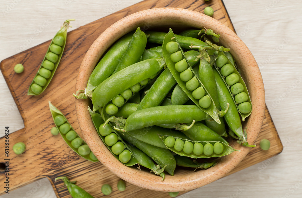 Composition with fresh green peas on wooden background, top view Composition with fresh green peas on wooden background, top view