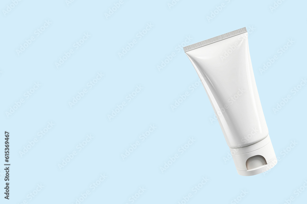 Mock-up of a white plastic tube of moisturizing cream on a light blue background. Flat plan, top view, copy space. Mock-up of a white plastic tube of moisturizing cream on a light blue background. Flat plan, top view, copy space.