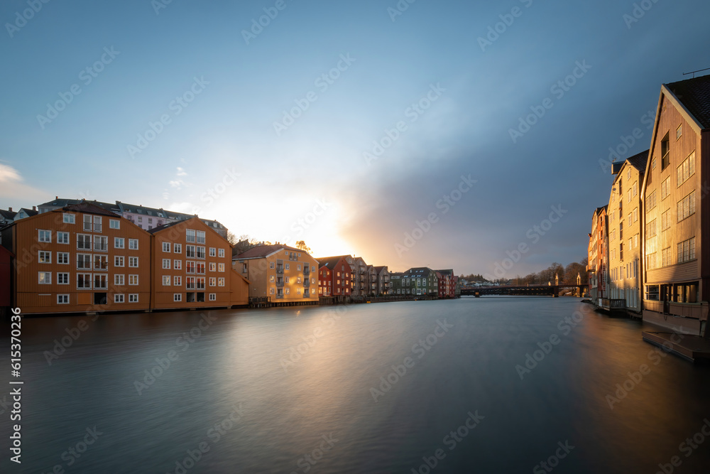 Naklejka premium Long exposure of colorful historic timber storehouses in Trondheim, Norway in winter