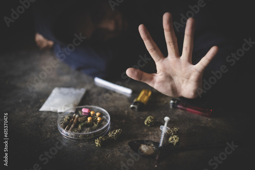 фотографія Human hands on dark background, Stop drug addiction concept, Do not interfere with drugs, International Day against Drug Abuse
