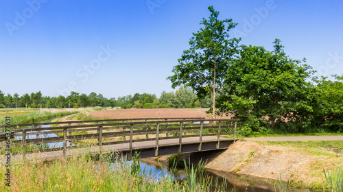 Wooden bridge over the Aalderstroom stream in Drenthe, Netherlands