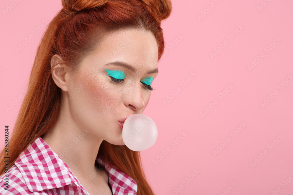 Beautiful woman with bright makeup blowing bubble gum on pink background. Space for text Beautiful woman with bright makeup blowing bubble gum on pink background. Space for text