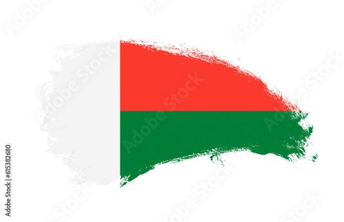 National flag of Madagascar painted with stroke brush on isolated white