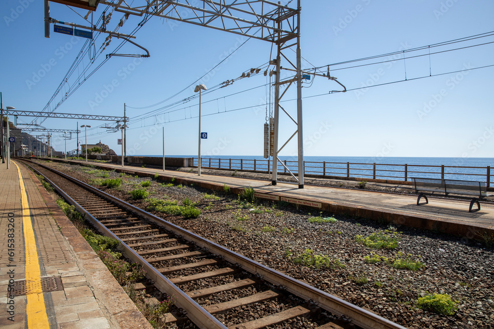 Devia Marina station tracks in Italy. No trains, no people, complete desolation and sadness. Beautiful open sea view