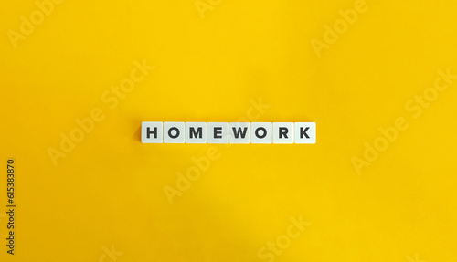 Homework Work on Block Letter Tiles on Yellow Background. Minimal Aesthetic.